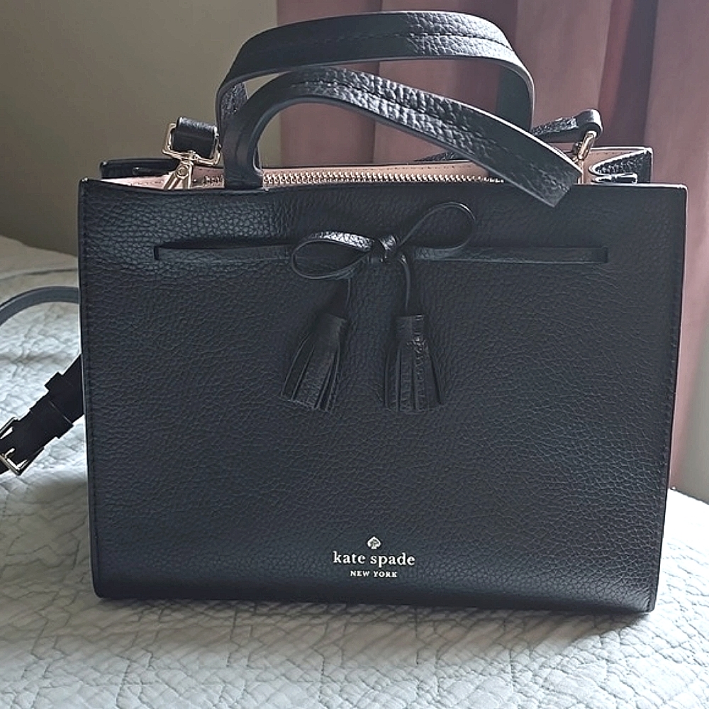 NWOT Black pebbled leather Kate Spade tote with tassel bow detail.